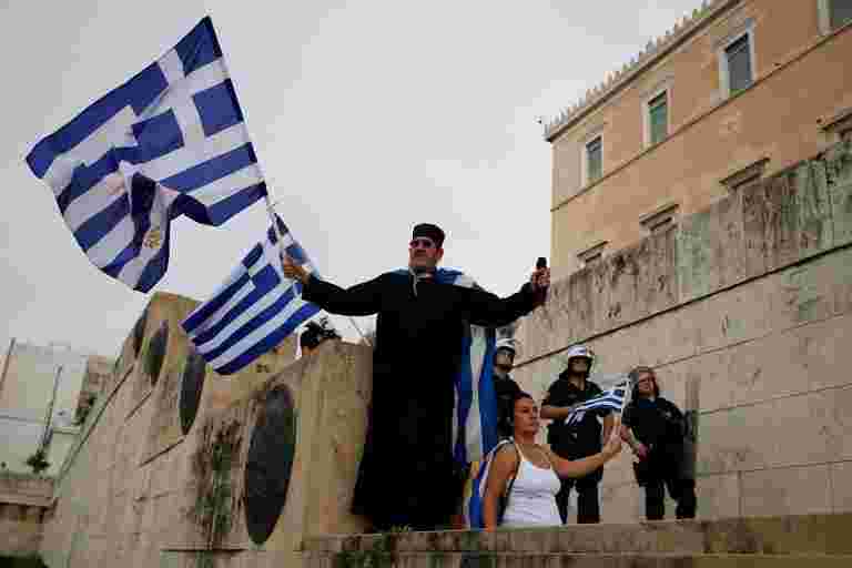 希腊设置为退出救助，仍然面临令人生畏的挑战
